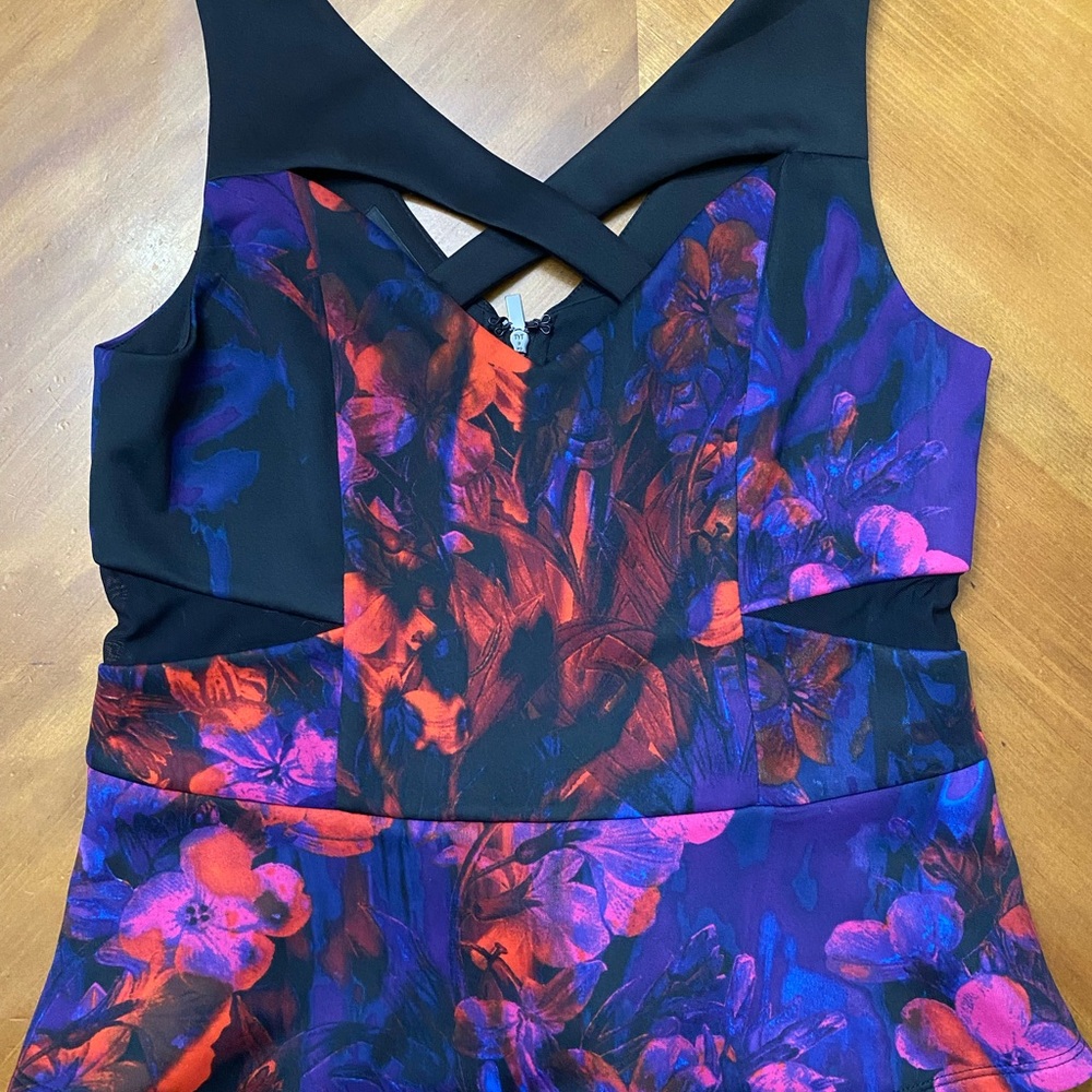 NWT Bebe Floral, cut-out peplum top  - Black and Purple